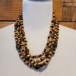 Multi-strand necklace in gold, brown, cream and faux tiger eye beads